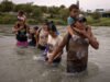 Migrants wade into the U.S. in Eagle Pass, Texas